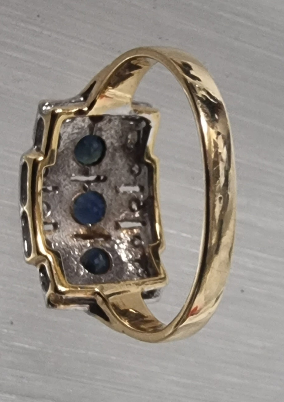 Blue sapphire with diamond ring set in white and yellow gold