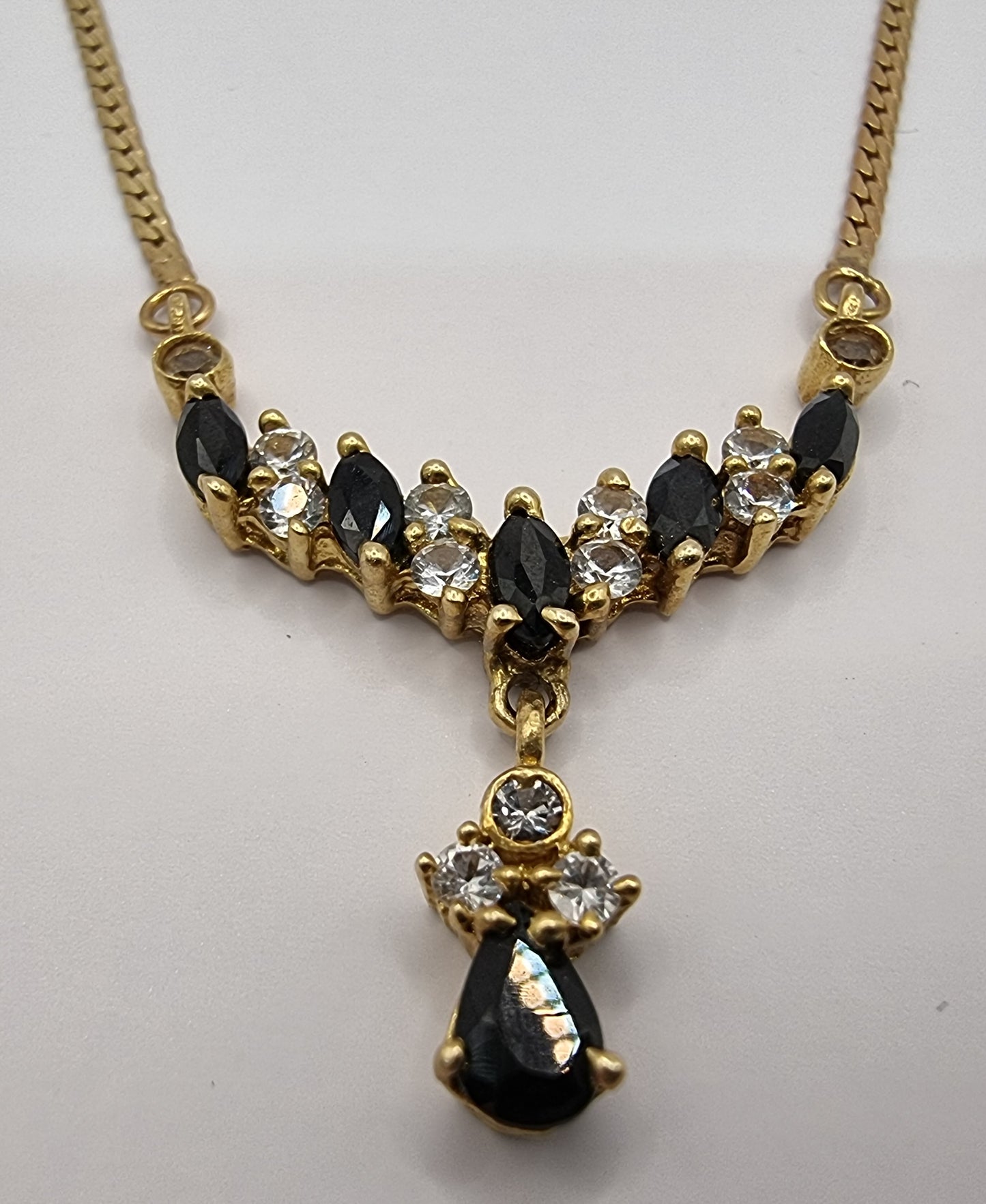 Lovely 14k yellow gold necklace,dark sapphire and crystal stone